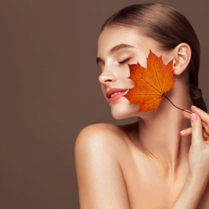 Ultherapy és Infini RF mikrotűs bőrfeszesítő kezelés után ragyogó, feszes arcbőrű nő egy őszi fényben